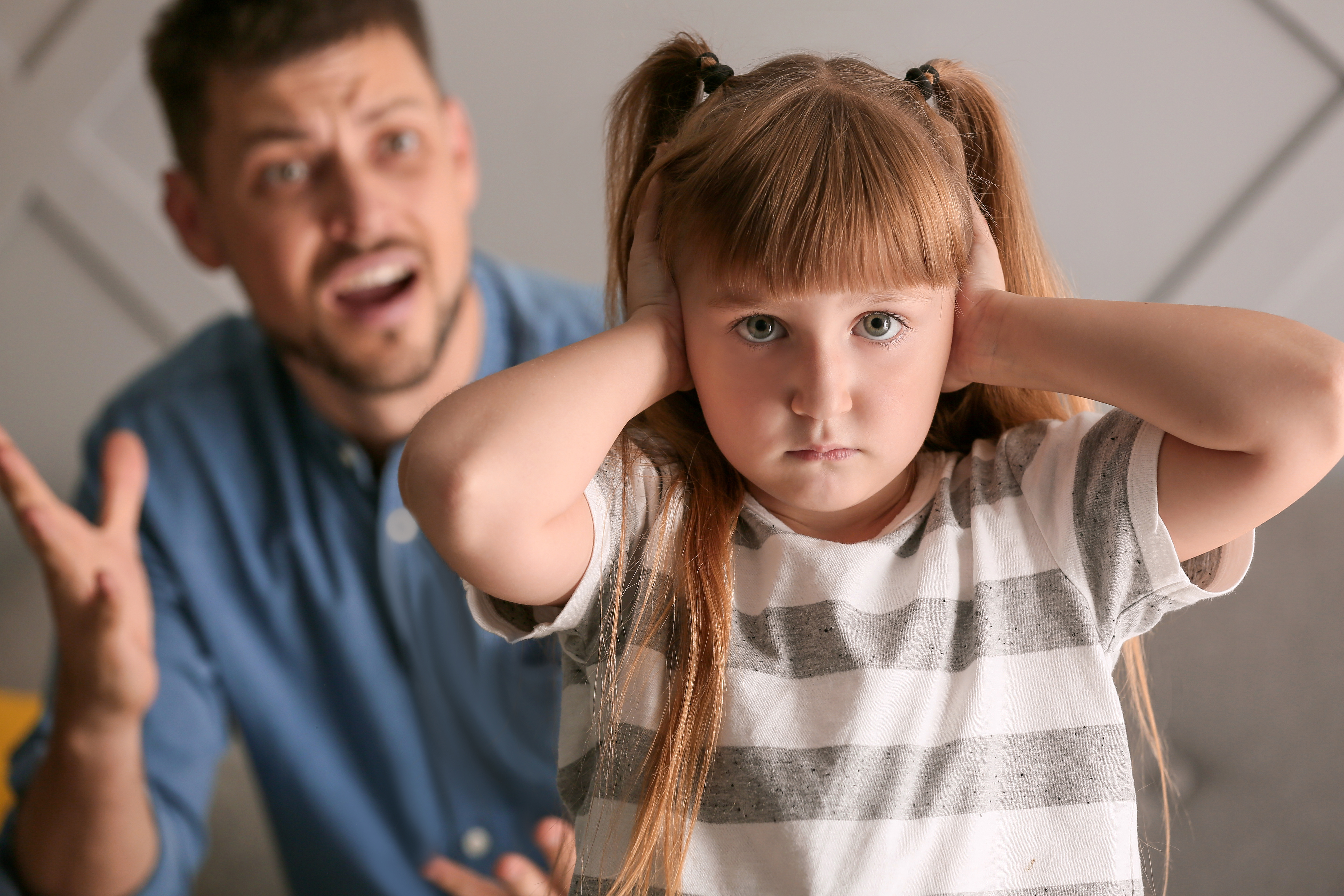 Angry Father Scolding His Little Daughter at Home